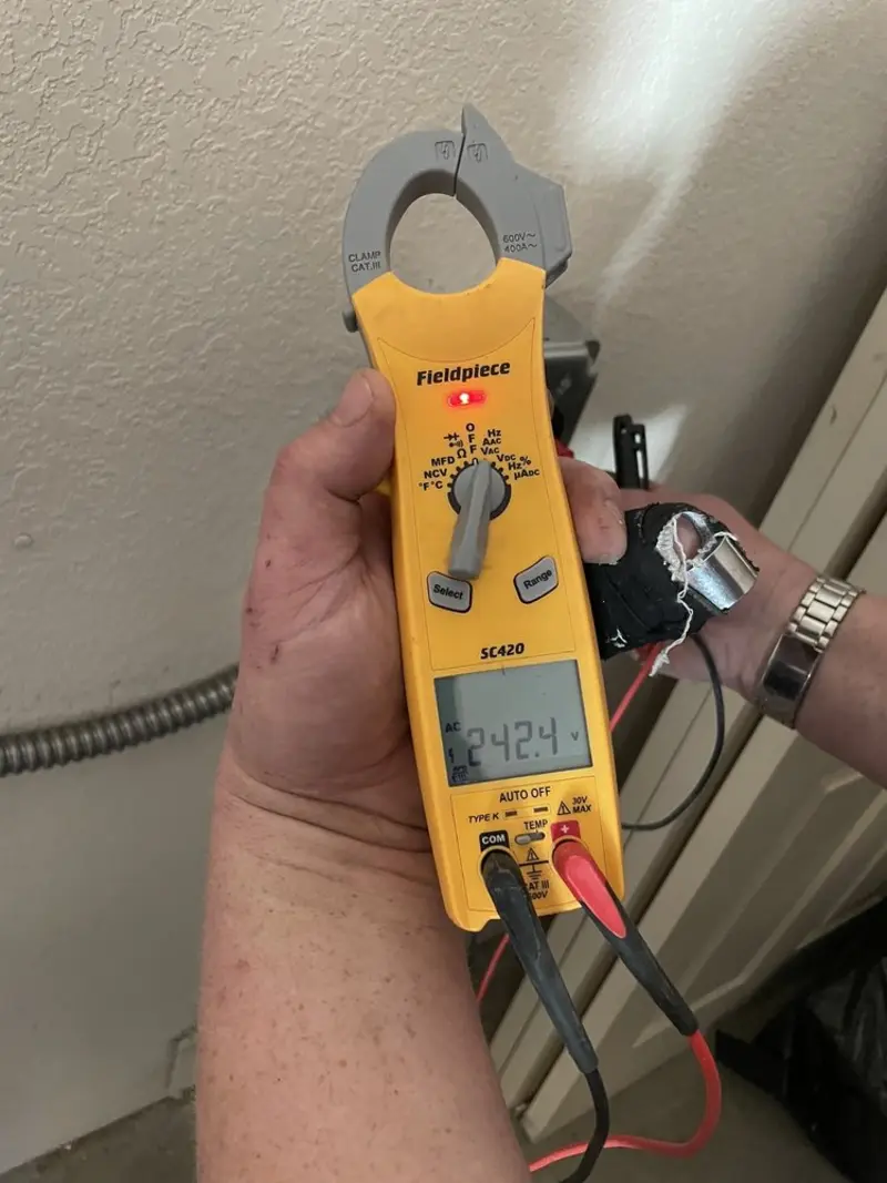 Voltage testing with clamp meter during Outlet Installation in Metairie